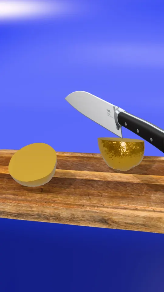 A Golden fruit cut in half on a blue studio